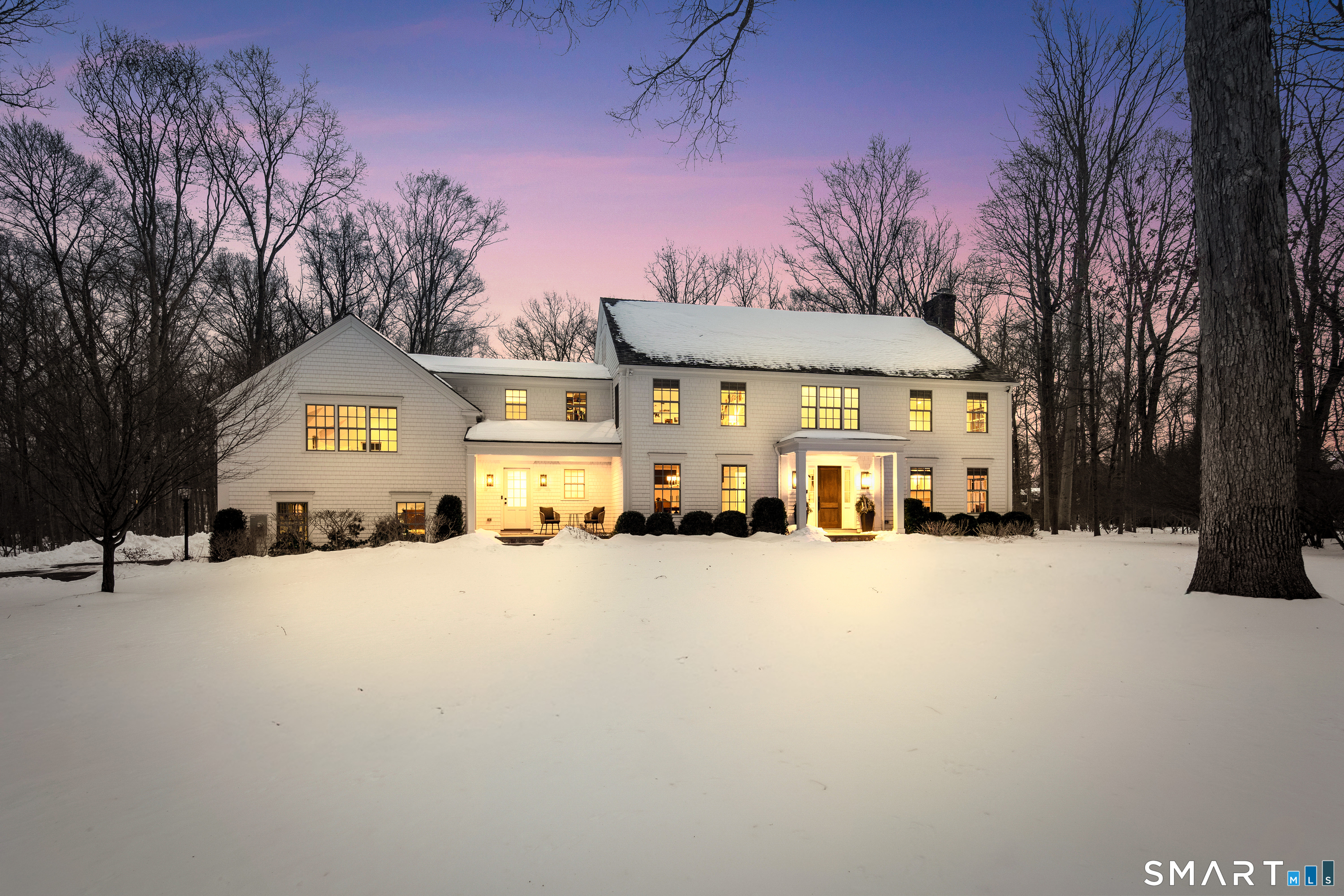 a large building with a large tree in front of it