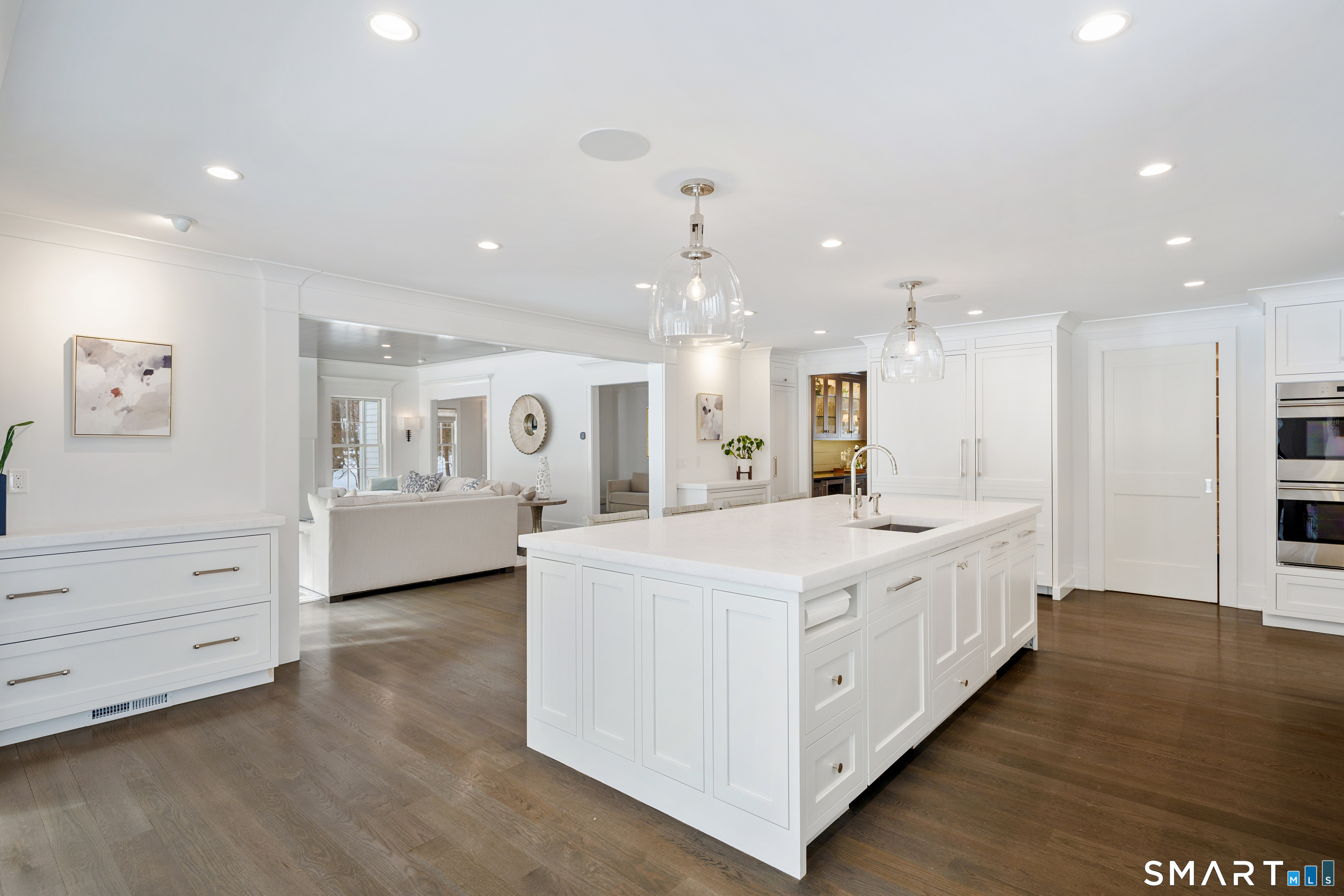 15 Marianne Road Darien, CT 06820 - Photo 11 of 36 a large white kitchen with kitchen island a sink stainless steel appliances and white cabinets