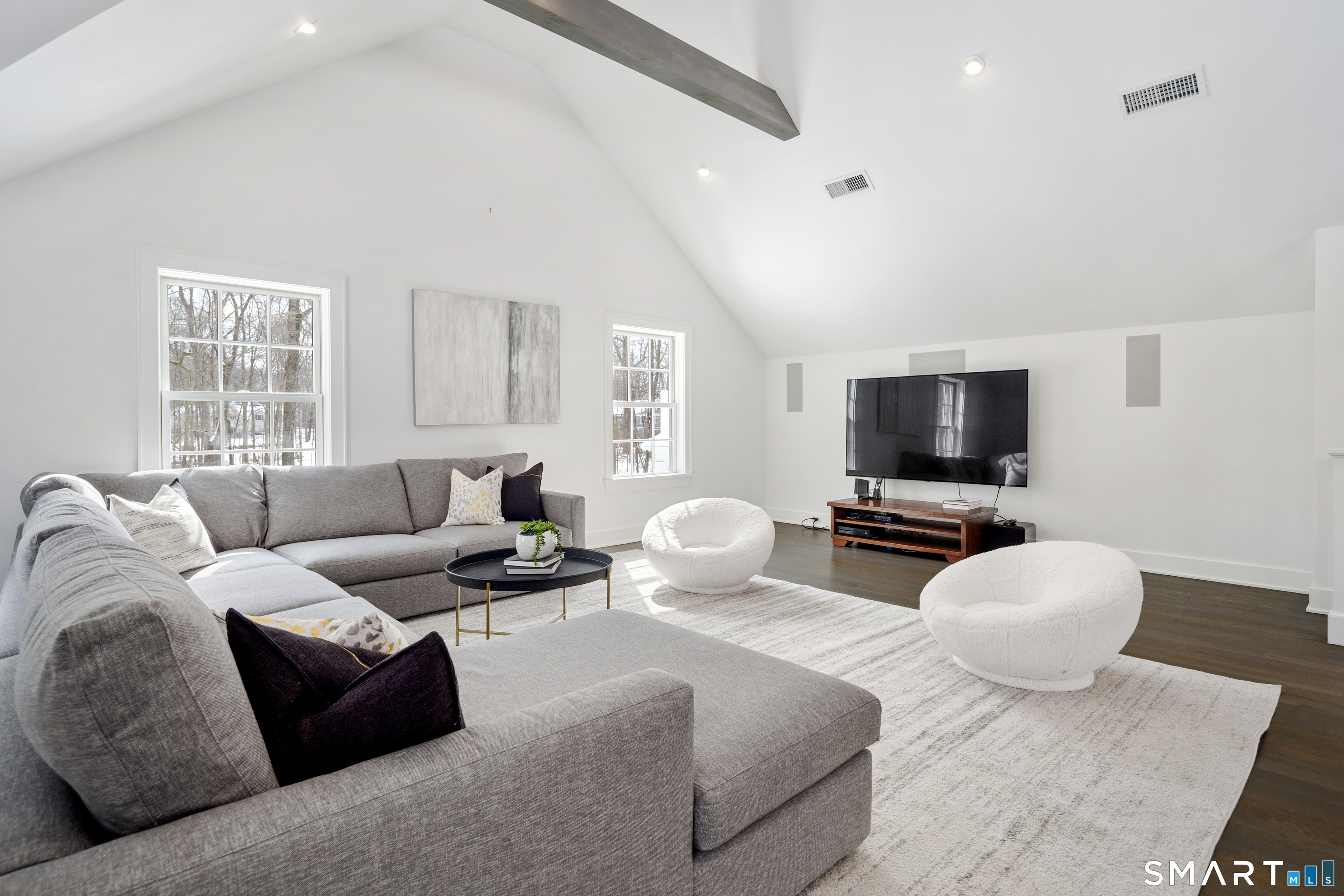 15 Marianne Road Darien, CT 06820 - Photo 26 of 36 a living room with furniture and a flat screen tv