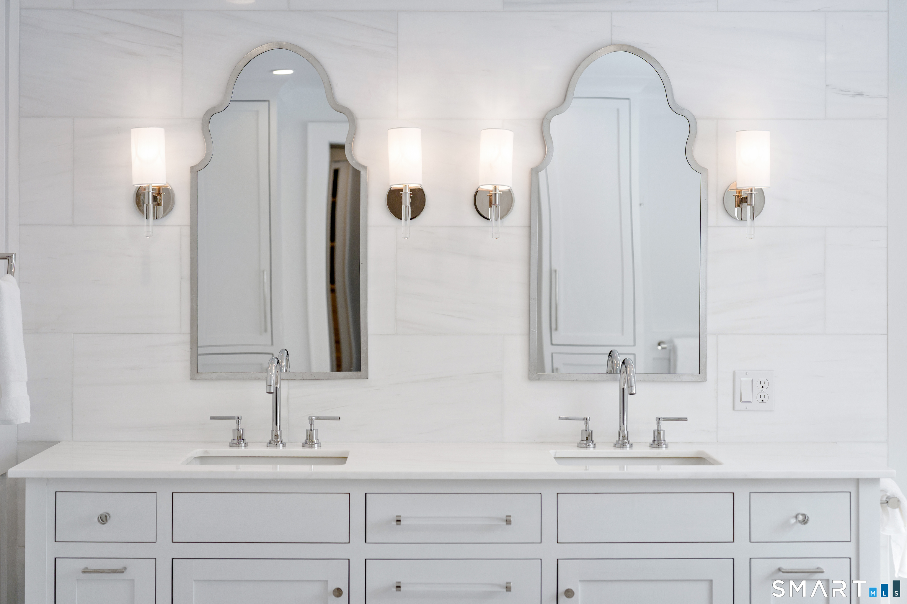 15 Marianne Road Darien, CT 06820 - Photo 31 of 36 a bathroom with a double vanity sink and a mirror