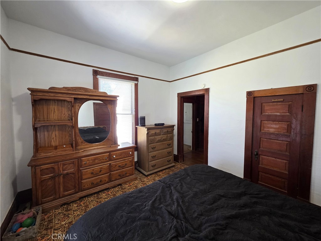 1414 Marin Street Corning, CA 96021 - Photo 25 of 43 a bedroom with a bed and furniture