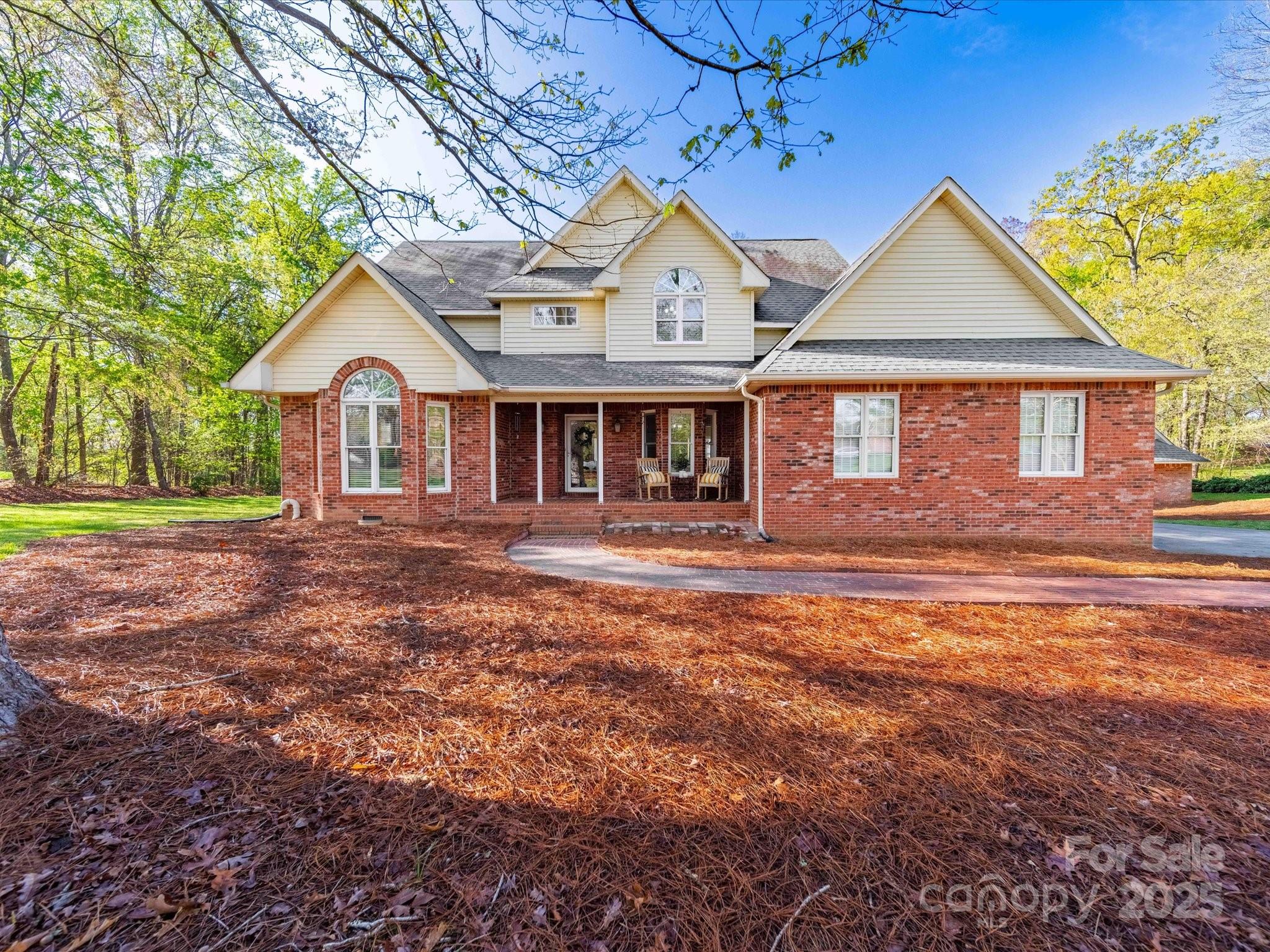 106 Berea Baptist Church Road Stanfield, NC 28163 - Photo 1 of 48 a front view of a house with a yard