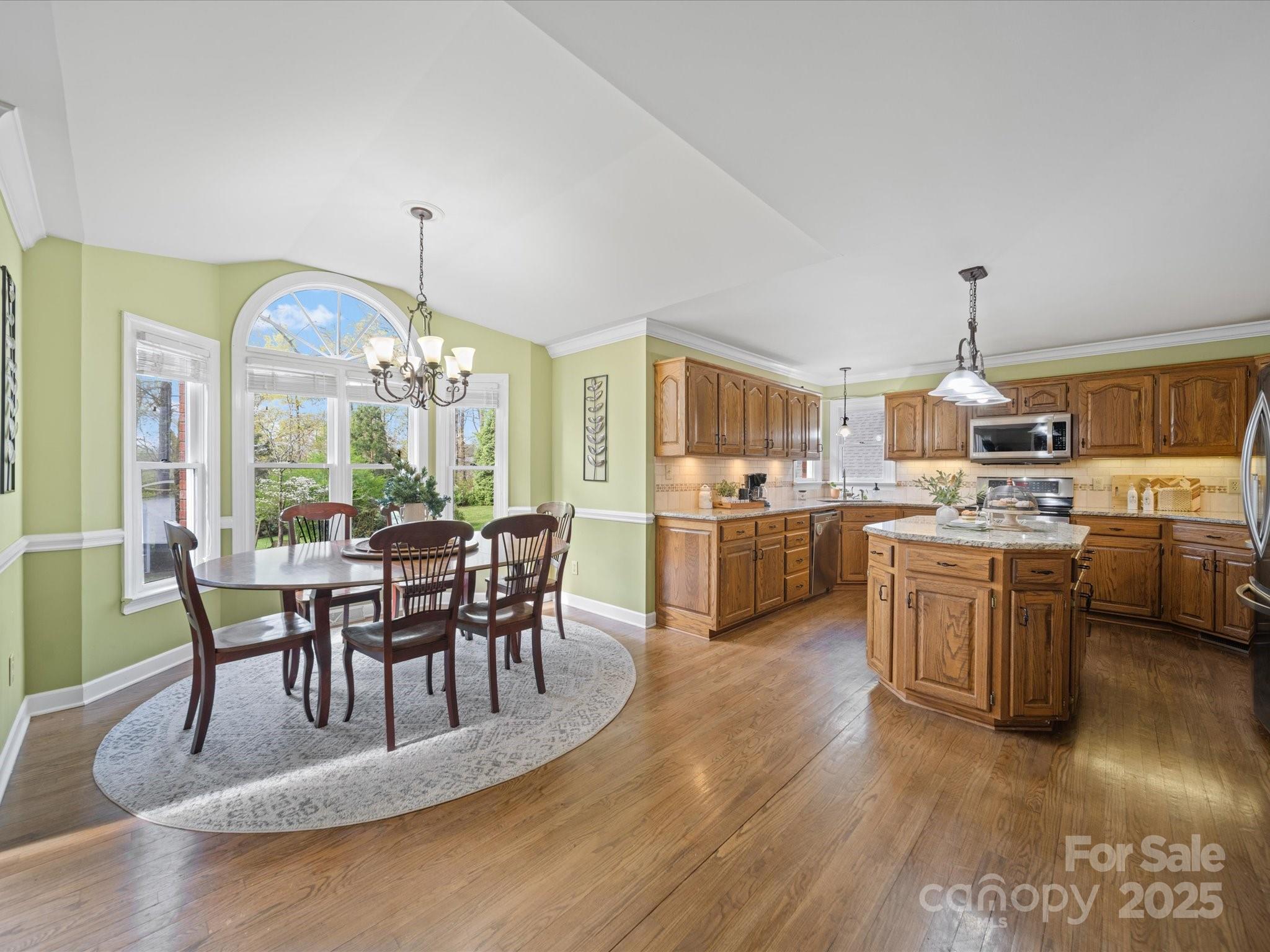 106 Berea Baptist Church Road Stanfield, NC 28163 - Photo 11 of 48 a view of a dining room with furniture window and wooden floor