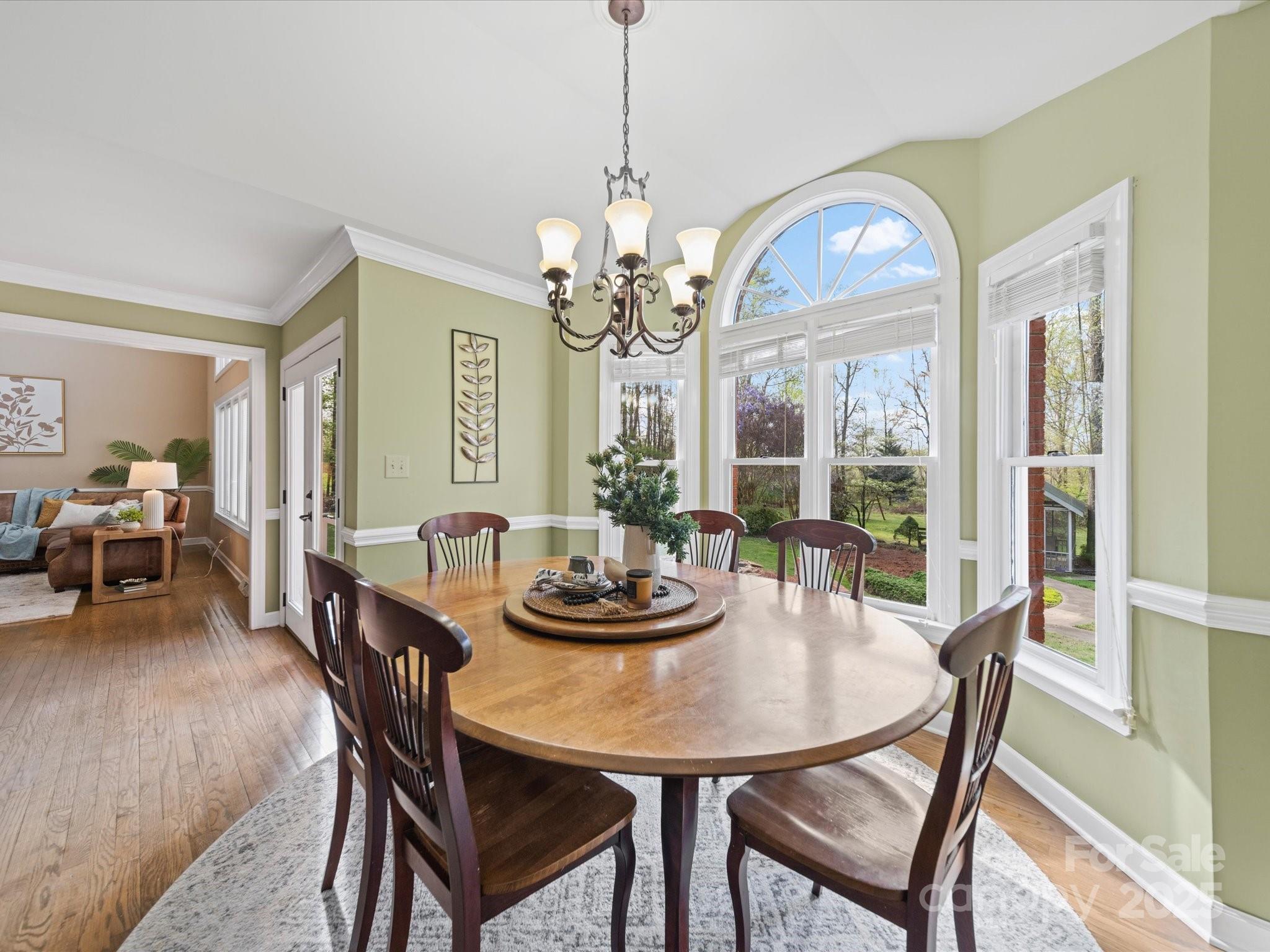 106 Berea Baptist Church Road Stanfield, NC 28163 - Photo 12 of 48 a view of a dining room with furniture and chandelier