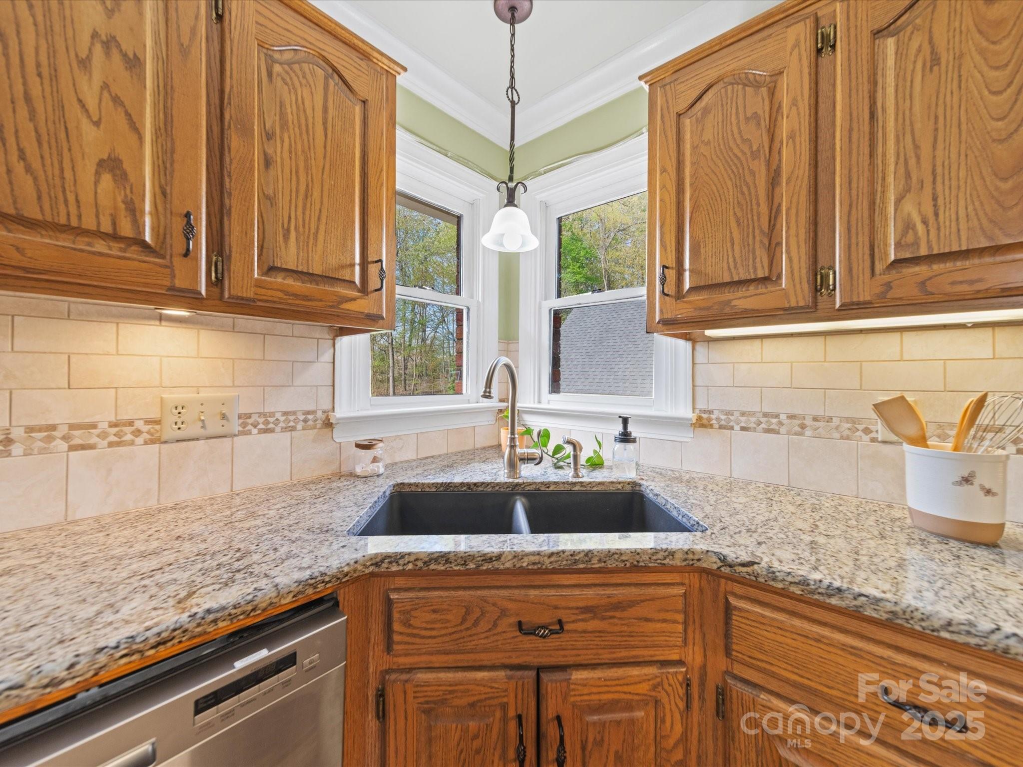 106 Berea Baptist Church Road Stanfield, NC 28163 - Photo 15 of 48 a kitchen with stainless steel appliances granite countertop a sink a counter space and cabinets