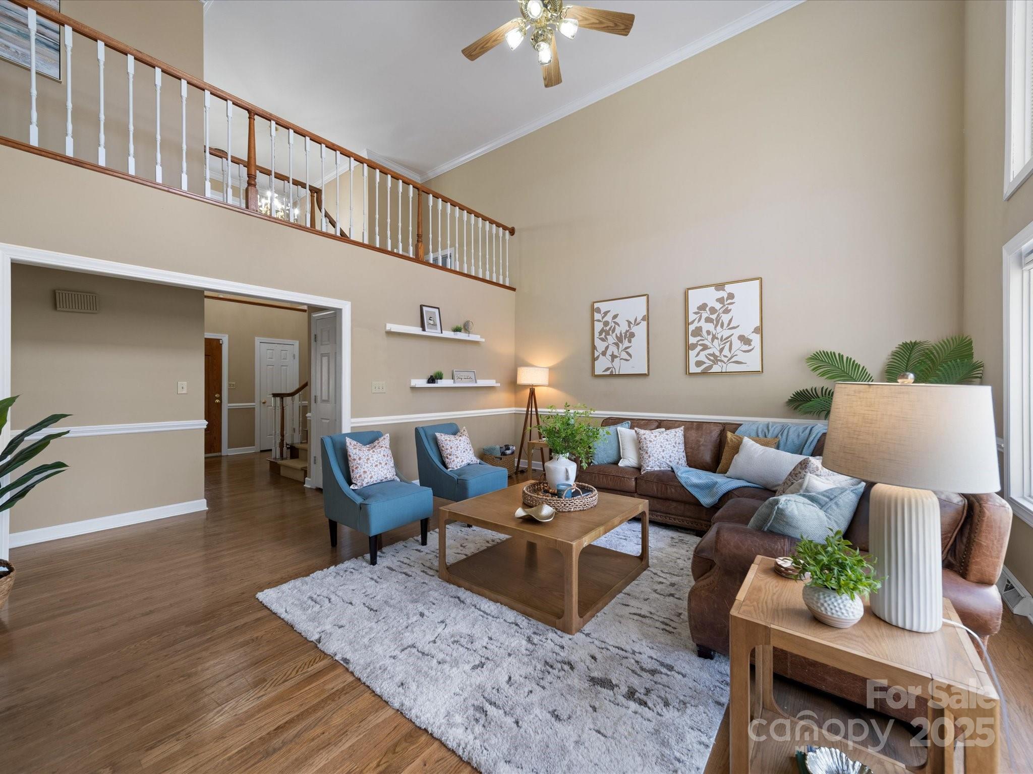 106 Berea Baptist Church Road Stanfield, NC 28163 - Photo 18 of 48 a living room with furniture wooden floor and a chandelier
