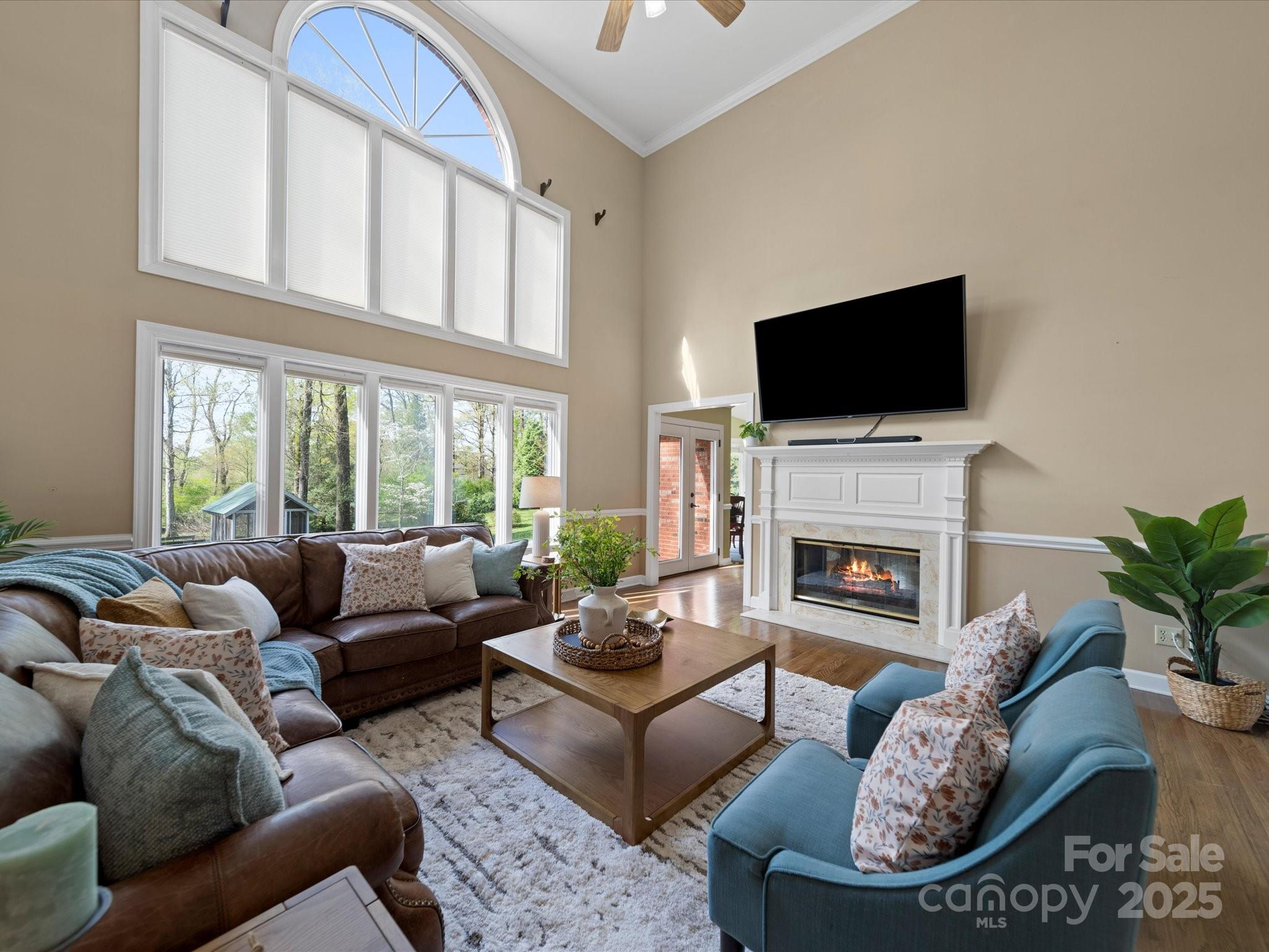 106 Berea Baptist Church Road Stanfield, NC 28163 - Photo 20 of 48 a living room with furniture a fireplace and a flat screen tv
