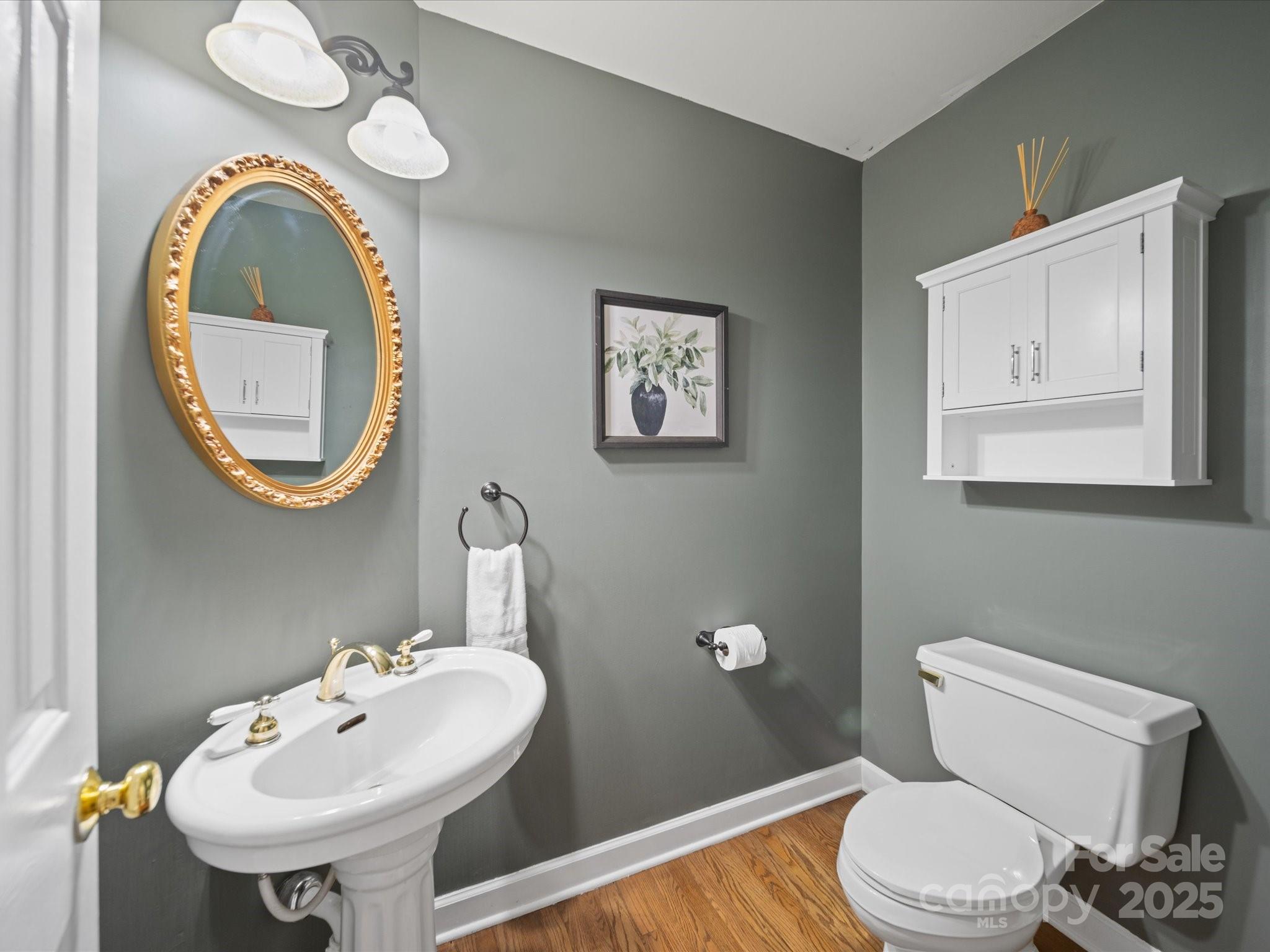 106 Berea Baptist Church Road Stanfield, NC 28163 - Photo 23 of 48 a bathroom with a toilet a sink and a mirror