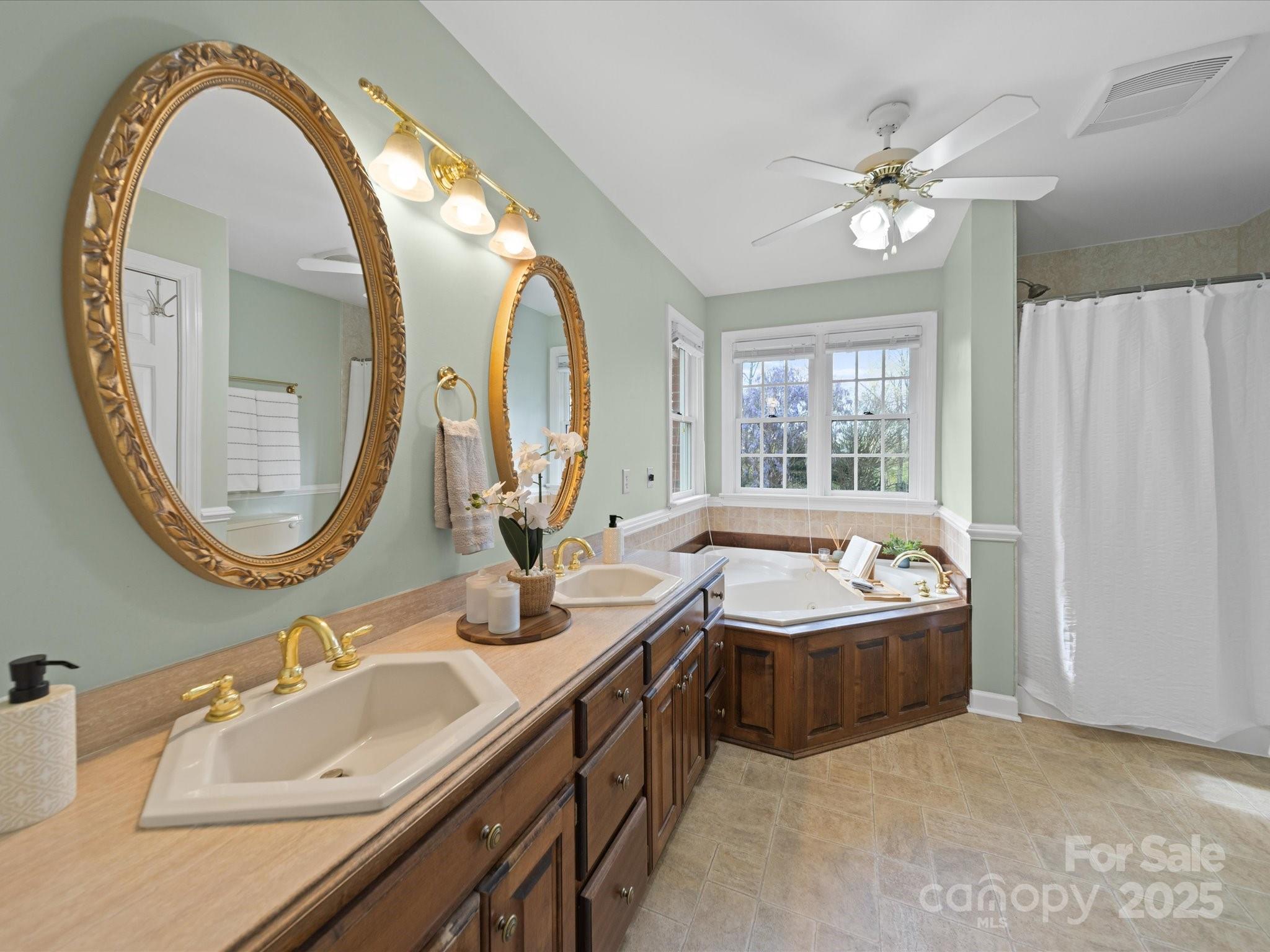 106 Berea Baptist Church Road Stanfield, NC 28163 - Photo 28 of 48 a bathroom with a tub sink and mirror
