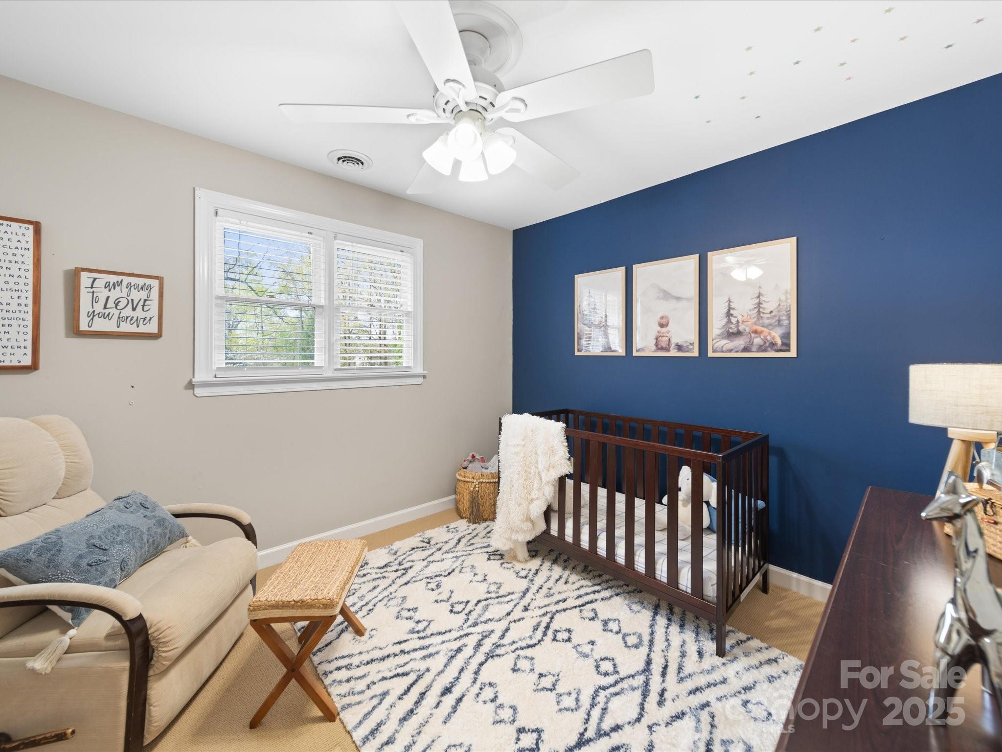 106 Berea Baptist Church Road Stanfield, NC 28163 - Photo 37 of 48 a bedroom with a bed and wooden floor