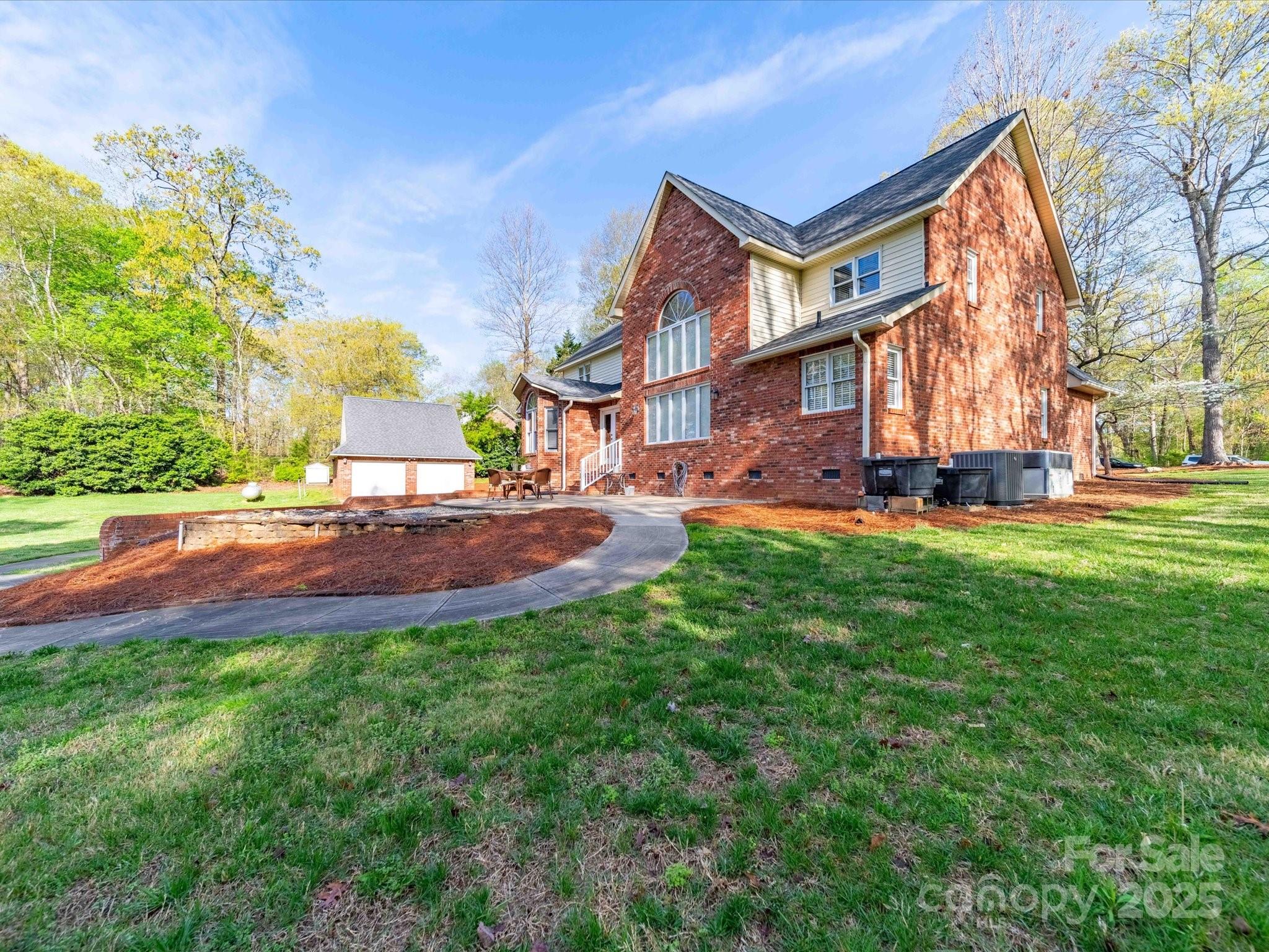 106 Berea Baptist Church Road Stanfield, NC 28163 - Photo 4 of 48 a view of a house with a big yard potted plants and a large tree