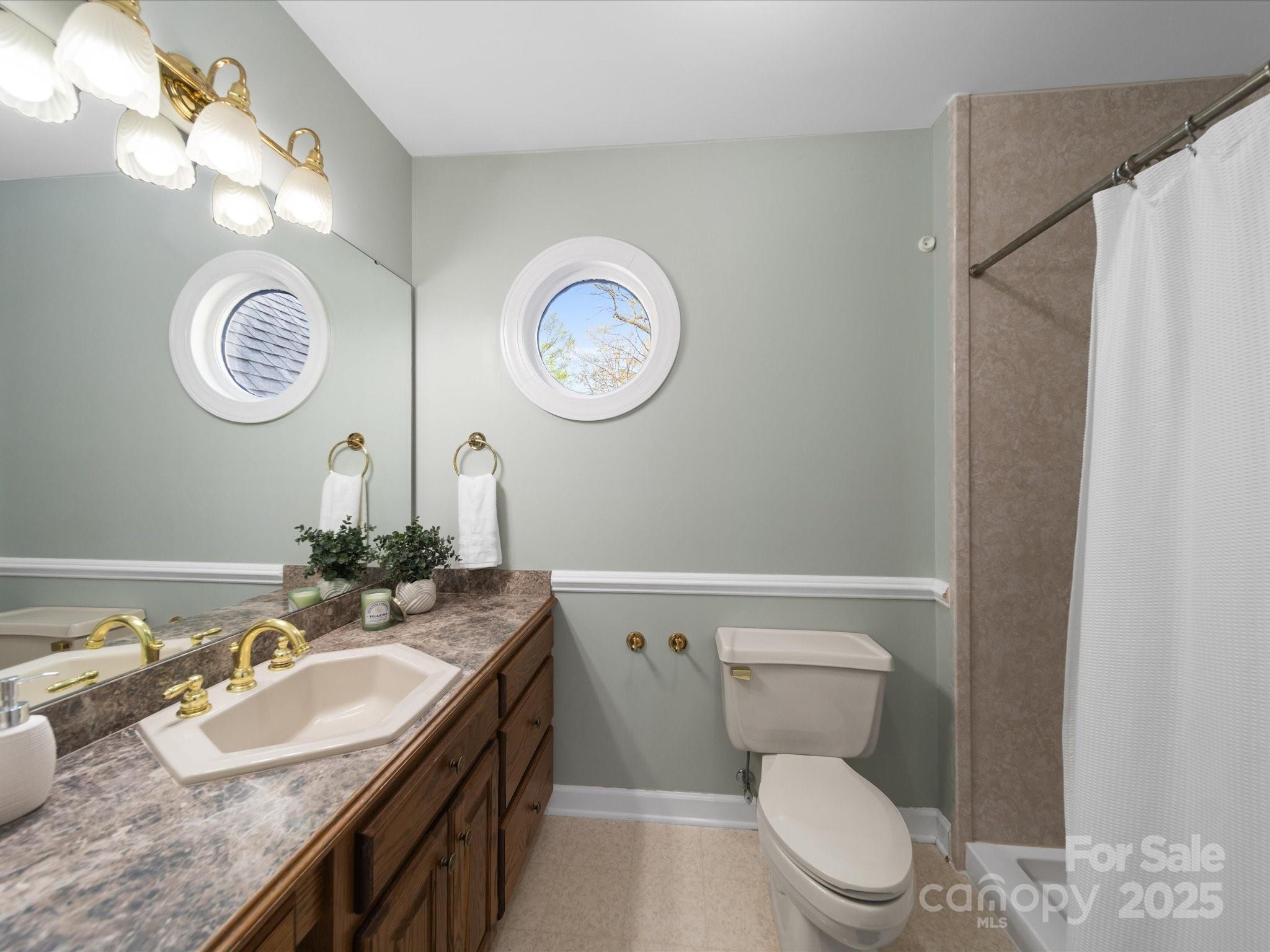 106 Berea Baptist Church Road Stanfield, NC 28163 - Photo 44 of 48 a bathroom with a granite countertop toilet sink and mirror