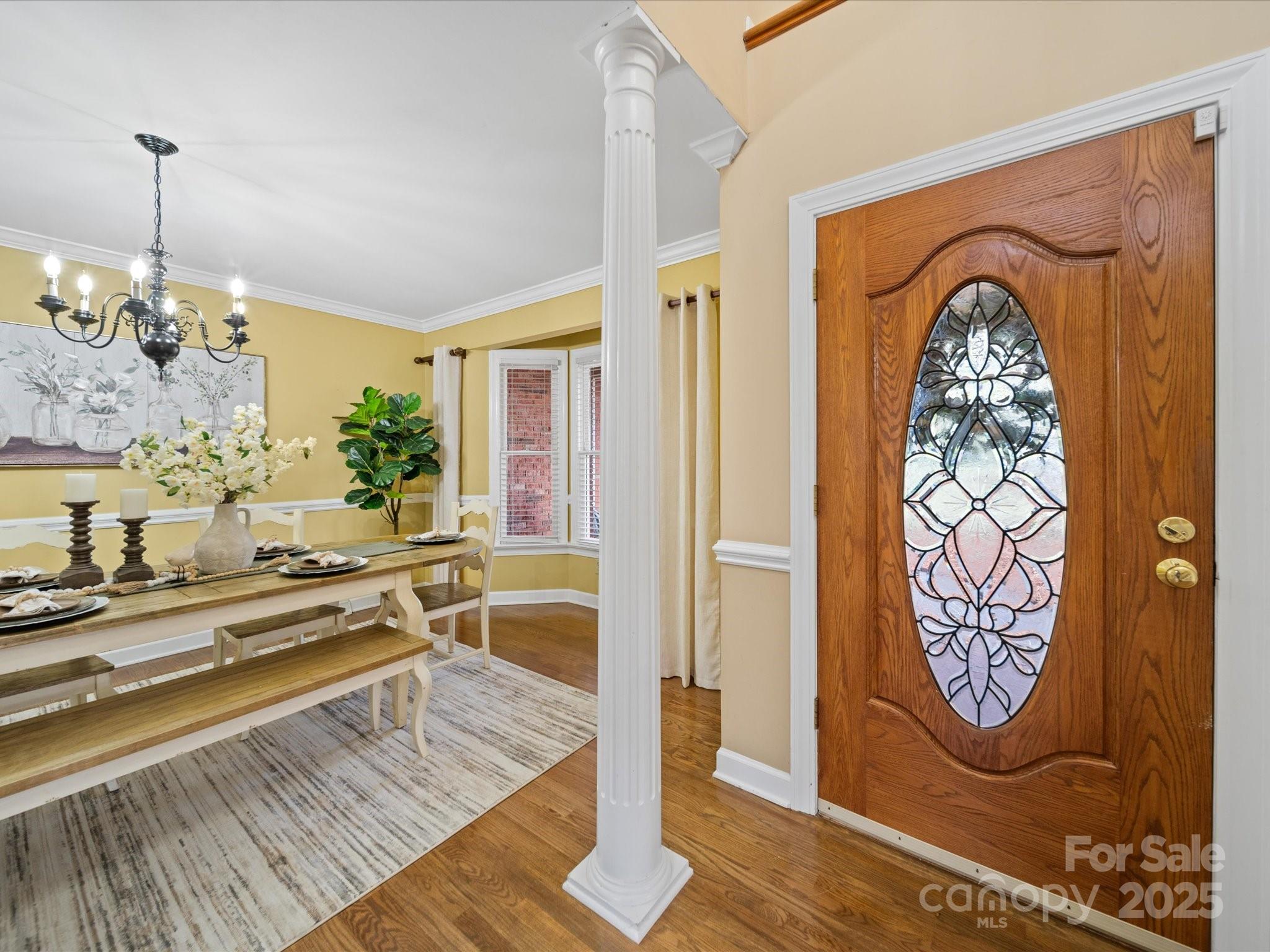 106 Berea Baptist Church Road Stanfield, NC 28163 - Photo 6 of 48 a very nice looking dining room with a table and a chandelier