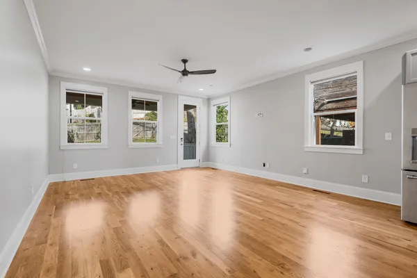 a kitchen with kitchen island a sink stainless steel appliances and cabinets