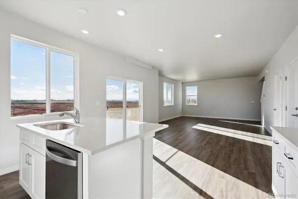 a kitchen with sink and window