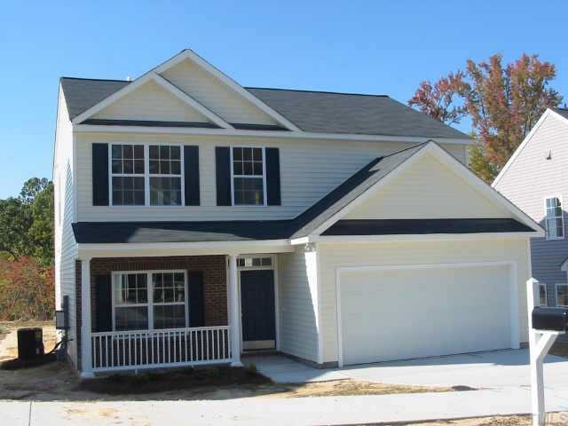 4050 Laurel Glen Drive Raleigh, NC 27610 - Photo 1 of 1 a view of a brick house with many windows