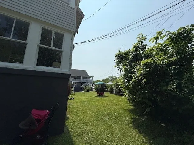a backyard of a house with lots of green space