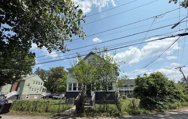 18-38 Beaver Court Framingham, MA 01702 - Photo 6 of 9 a backyard of a house with lots of green space