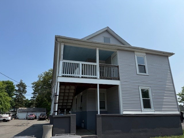 18-38 Beaver Court Framingham, MA 01702 - Photo 6 of 10 a front view of a house with garage