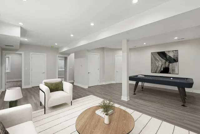 a bathroom with a double vanity sink and a bathtub