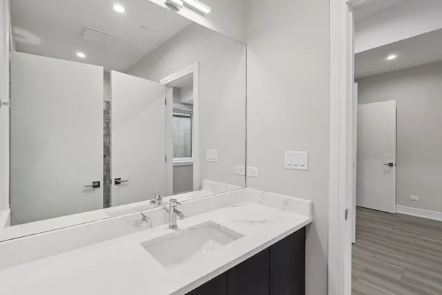 a bathroom with a shower and a sink