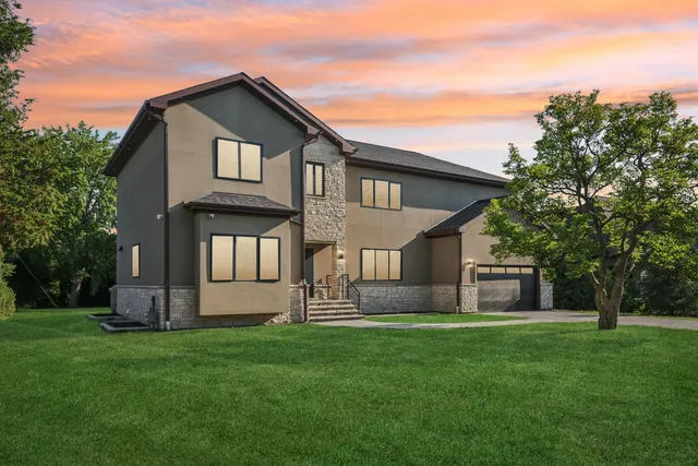 an aerial view of a house with a yard