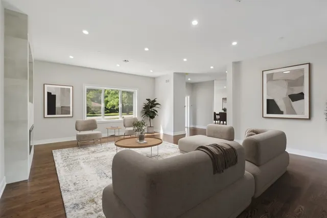 a spacious bedroom with a large bed and a large window