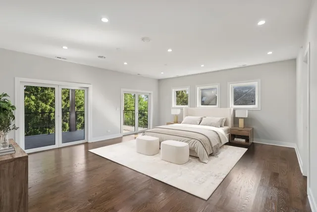 a bedroom with a bed and a potted plant