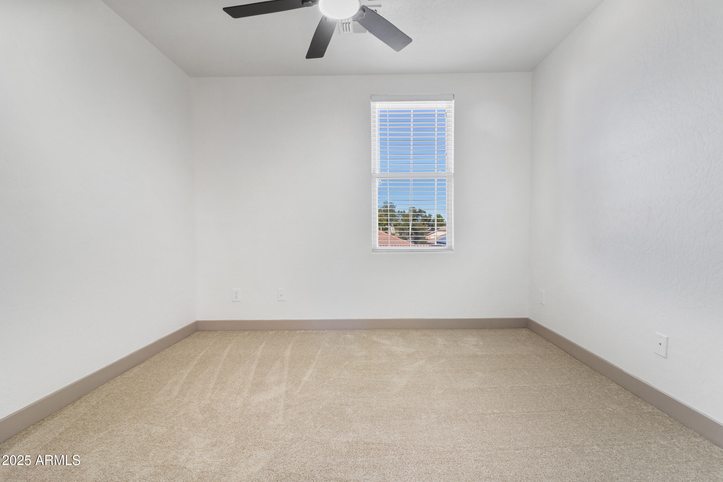 16329 West Rimrock Street Surprise, AZ 85388 - Photo 24 of 31 an empty room with a window