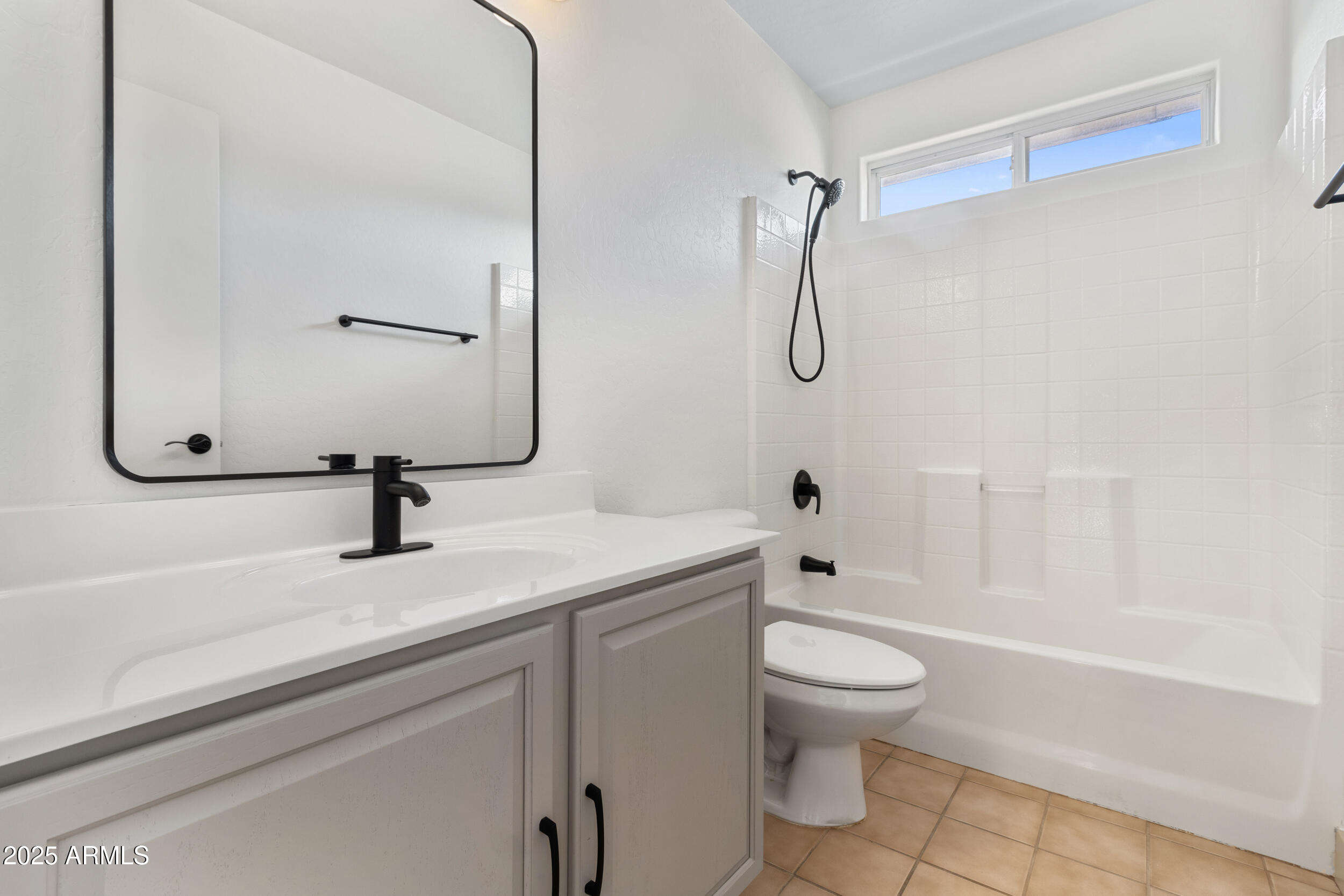 16329 West Rimrock Street Surprise, AZ 85388 - Photo 26 of 31 a bathroom with a sink toilet vanity and shower
