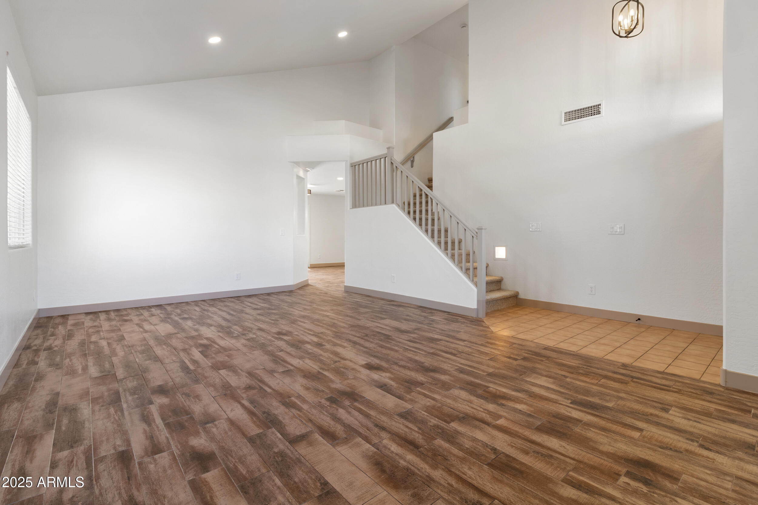 16329 West Rimrock Street Surprise, AZ 85388 - Photo 3 of 31 a view of a room with wooden floor