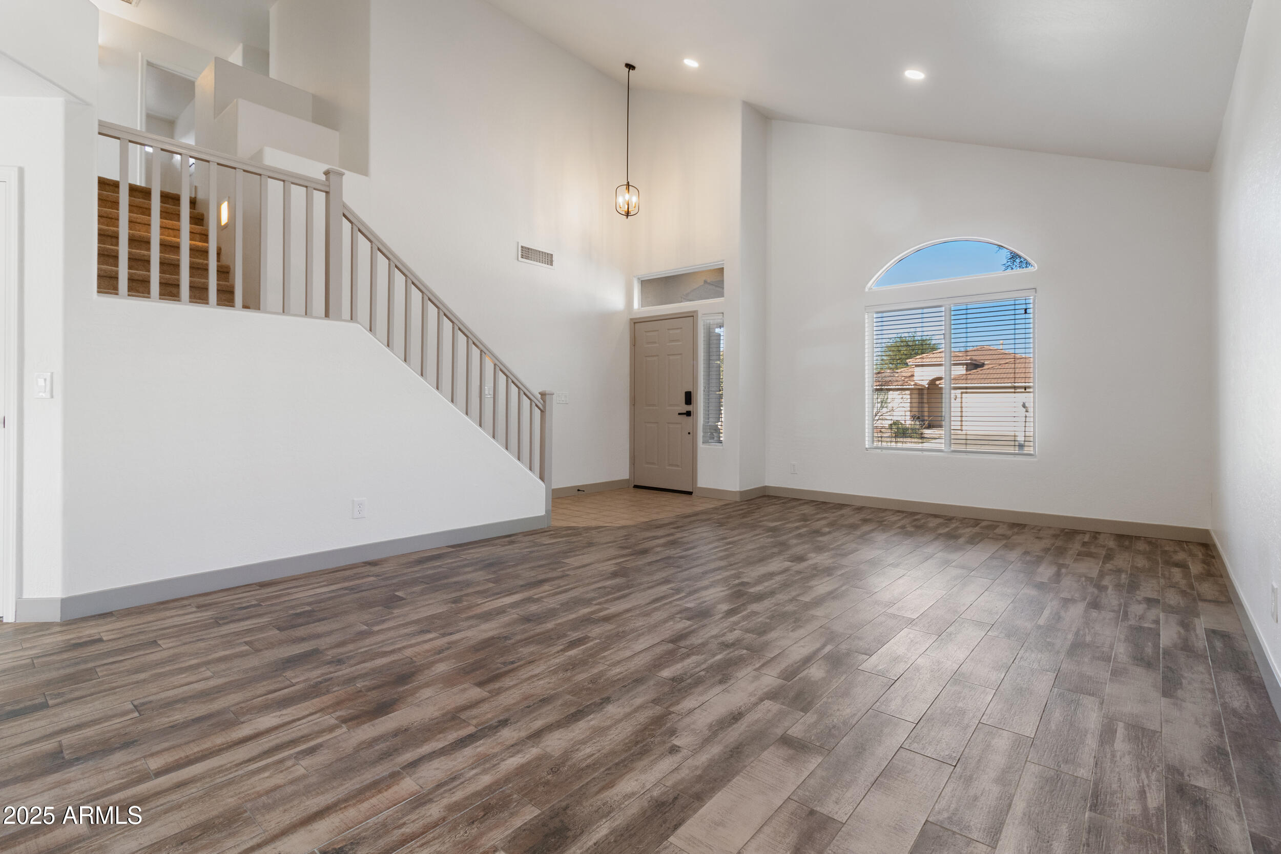 16329 West Rimrock Street Surprise, AZ 85388 - Photo 4 of 31 a view of an entryway with wooden floor