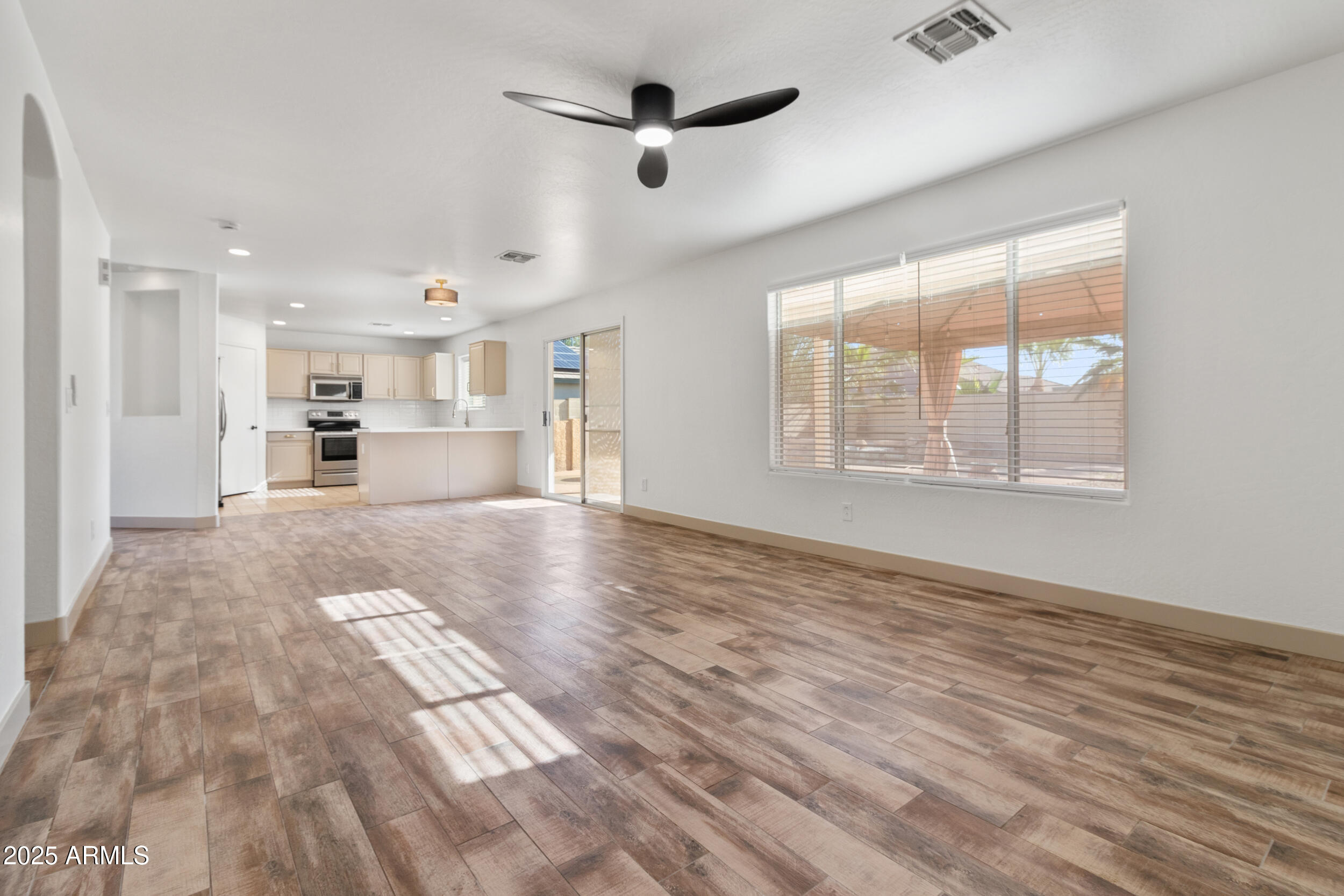 16329 West Rimrock Street Surprise, AZ 85388 - Photo 7 of 31 a view of an empty room with a window