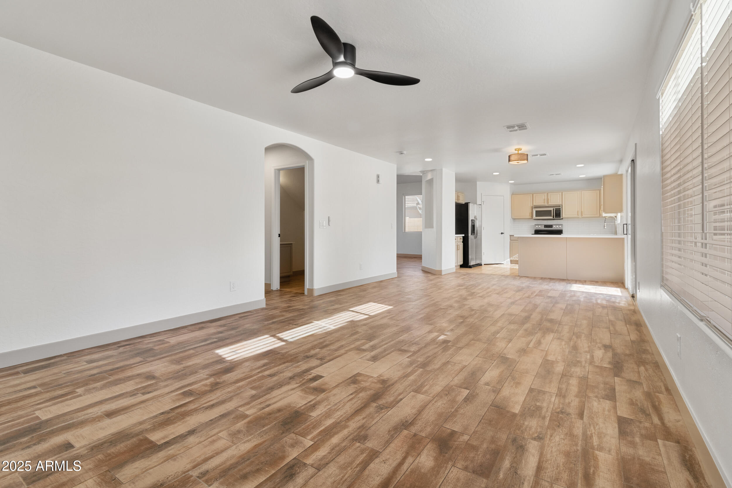 16329 West Rimrock Street Surprise, AZ 85388 - Photo 9 of 31 a view of an empty room and kitchen view