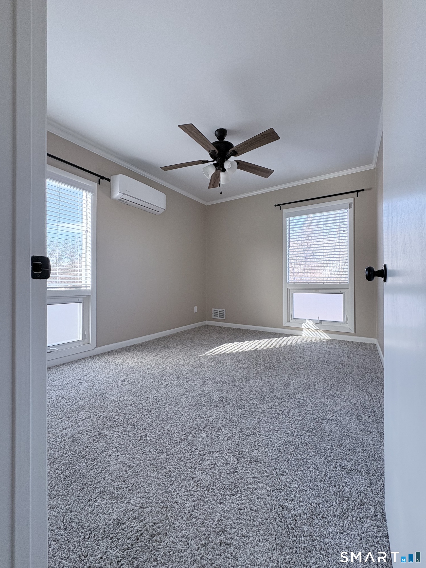 80 A Balaban Road, Unit A/ON Colchester, CT 06415 - Photo 18 of 24 a view of a livingroom with a ceiling fan and window