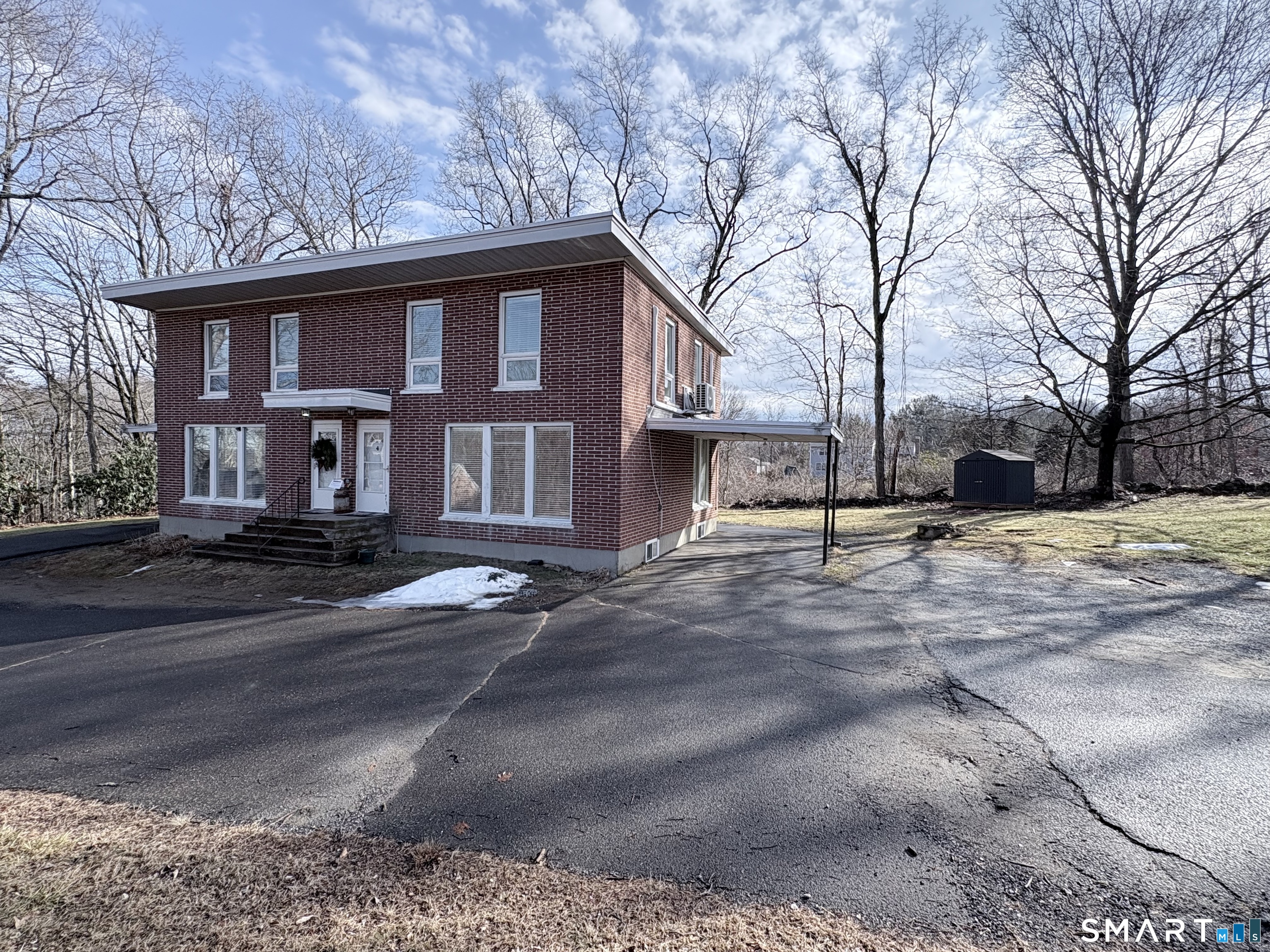 80 A Balaban Road, Unit A/ON Colchester, CT 06415 - Photo 2 of 24 a front view of a house with a yard