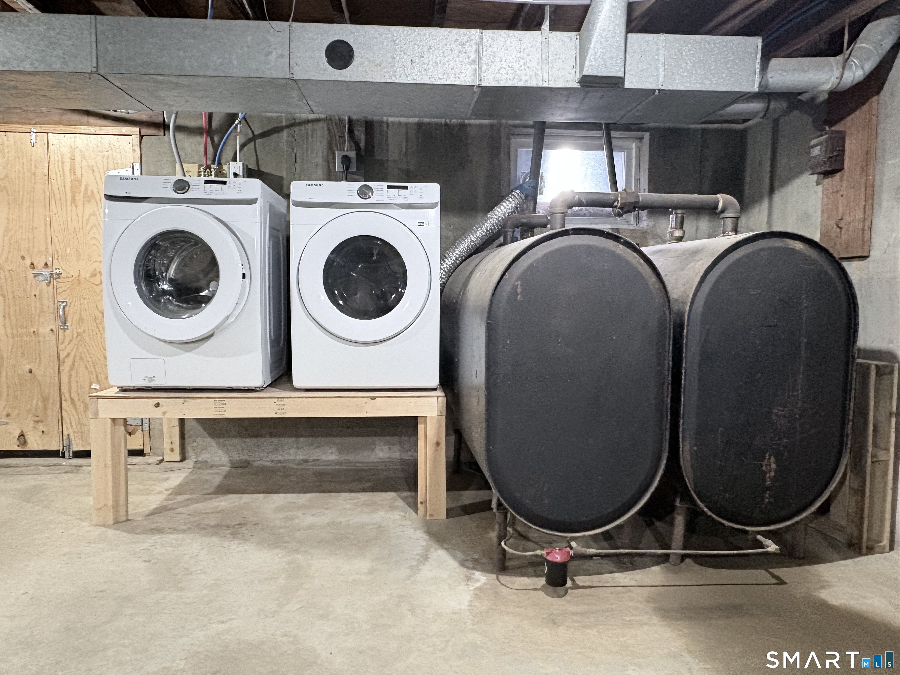 80 A Balaban Road, Unit A/ON Colchester, CT 06415 - Photo 22 of 24 a bathroom with a washing machine and mirror