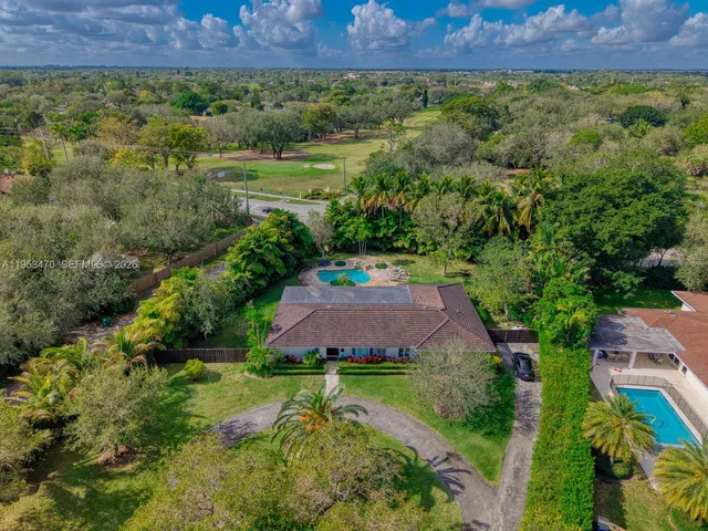 a view of a garden with a building