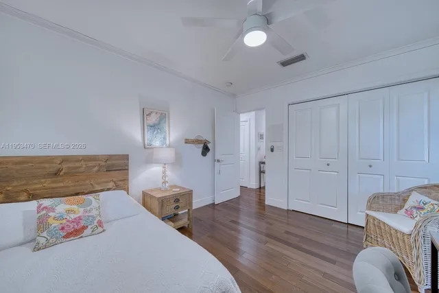 a spacious bedroom with a bed and furniture