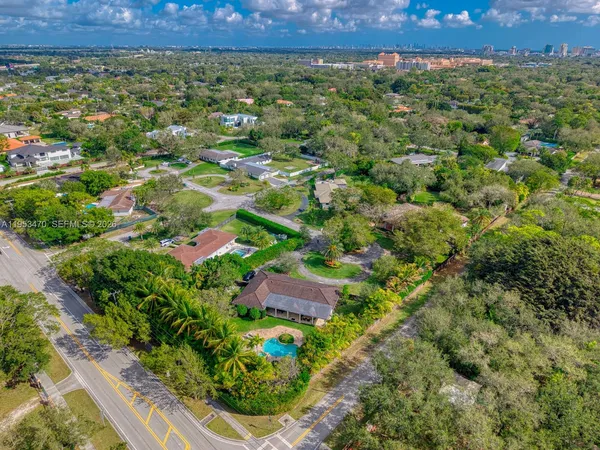 an aerial view of a house with a yard