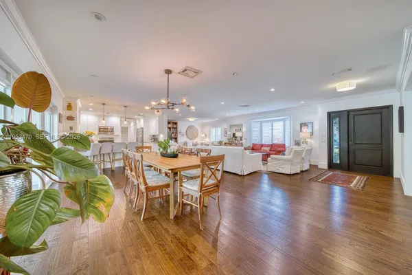 a very nice looking dining room with a table and chairs