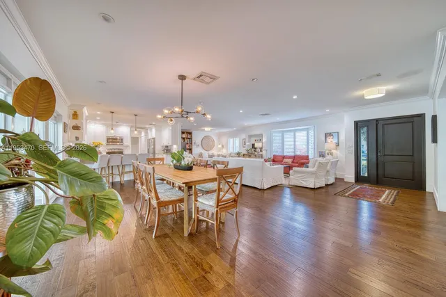 a very nice looking dining room with a table and chairs