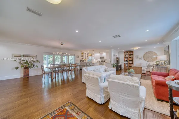 a living room with fireplace furniture and a wooden floor