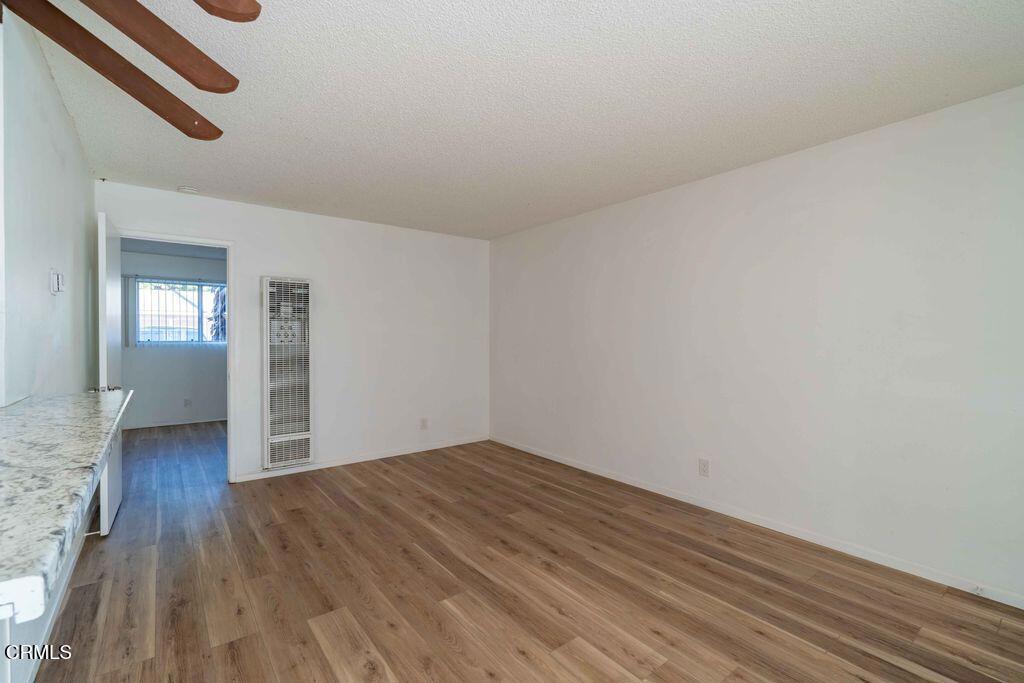 1925 Ginger Street, Unit 104 Oxnard, CA 93036 - Photo 11 of 25 wooden floor in an empty room