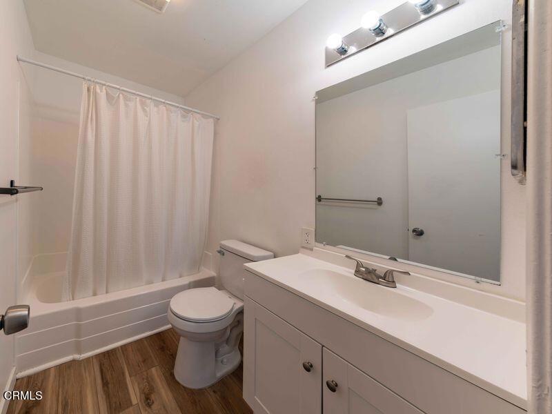 1925 Ginger Street, Unit 104 Oxnard, CA 93036 - Photo 12 of 25 a bathroom with a sink a toilet and shower