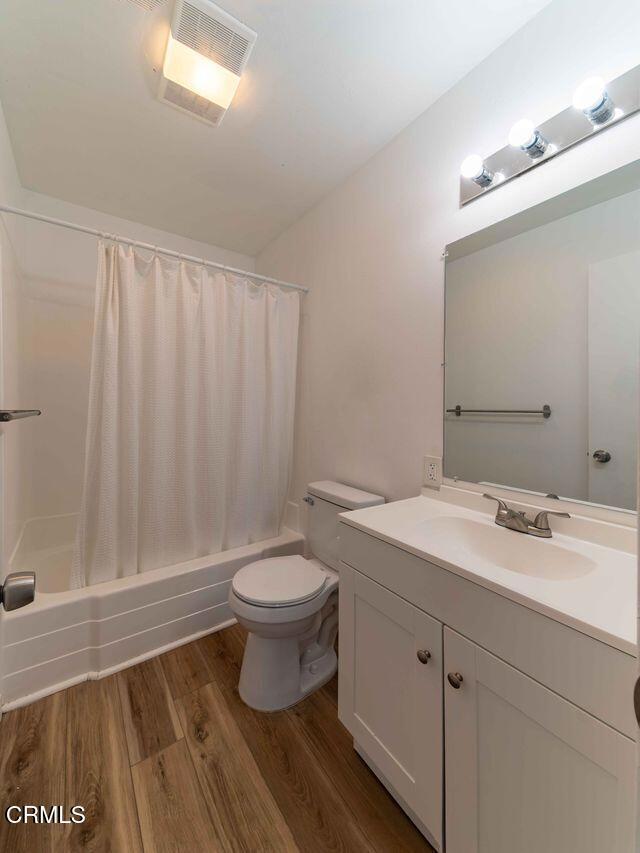 1925 Ginger Street, Unit 104 Oxnard, CA 93036 - Photo 13 of 25 a bathroom with a sink and a mirror
