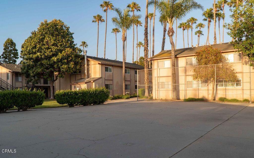 1925 Ginger Street, Unit 104 Oxnard, CA 93036 - Photo 16 of 25 a front view of a building with a garden