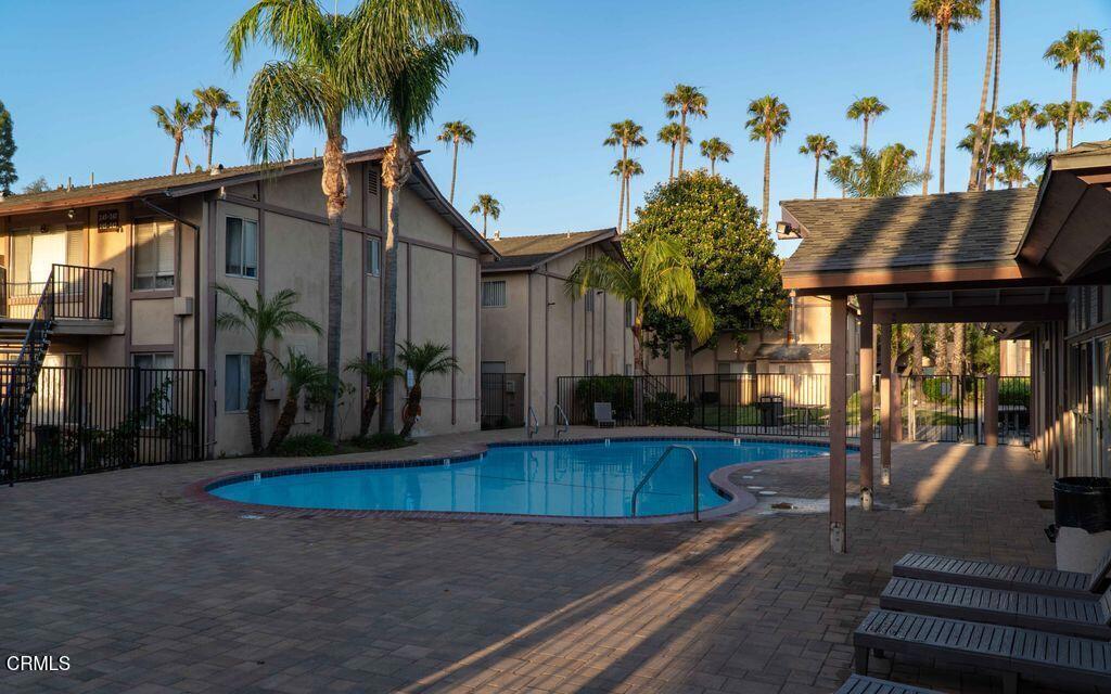 1925 Ginger Street, Unit 104 Oxnard, CA 93036 - Photo 19 of 25 swimming pool view with glass windows and plants