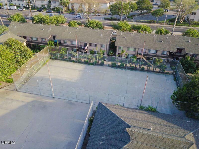 1925 Ginger Street, Unit 104 Oxnard, CA 93036 - Photo 21 of 25 an aerial view of a house with a garden and lake view