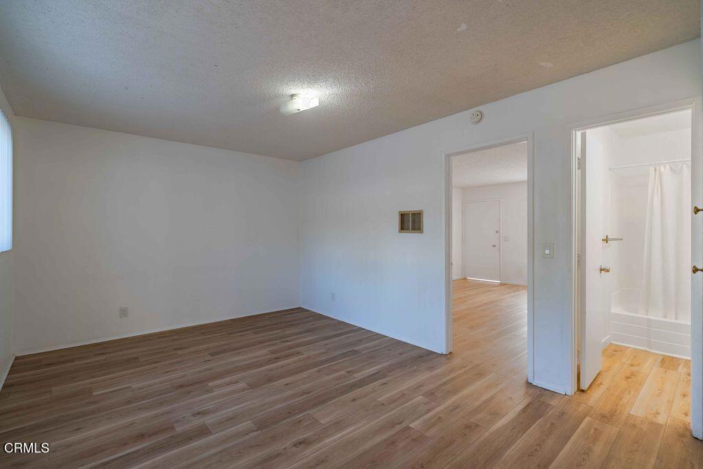 1925 Ginger Street, Unit 104 Oxnard, CA 93036 - Photo 8 of 25 a view of a room with wooden floor